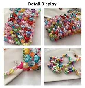 Detail showing heart-shaped acrylic beads and multi-colored plastic chain strap