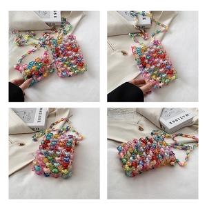 Detail of handmade jelly heart beaded bags in small and large sizes with bead straps