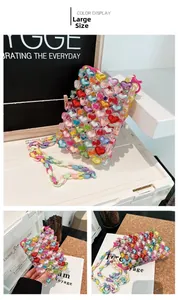 Macro detail of a large heart-shaped beaded handbag with colorful acrylic beads and strap