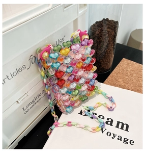 Detailed view of colorful translucent heart-shaped beads and macaron link chain strap