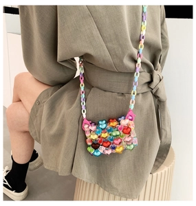 Detail of multi-color heart-shaped acrylic beaded mini bag with adjustable plastic chain strap