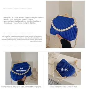 Close-up of blue pleated PU handbag featuring pearl handle and gold chain strap
