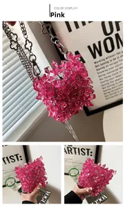 Detailed macro view of pink acrylic bead mini bag with stylish silver clover chain strap