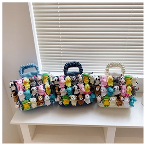 Three colorful tote bags featuring numerous cute stuffed animal charms and soft textures