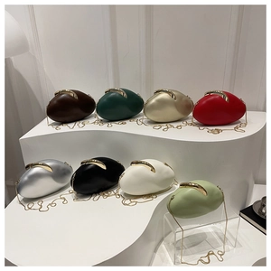 Oval clutch evening bags with gold metal clasps and chain straps in eight stylish colors