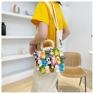 Detail of canvas bag featuring colorful plush animal dolls and pleated handle texture