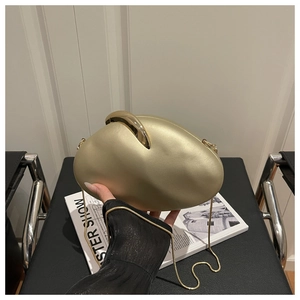 Detailed view of a gold oval acrylic evening clutch with frosted finish and metal chain