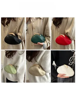 Cloud-shaped crossbody bags in six colors with gold metal clasps shown on models