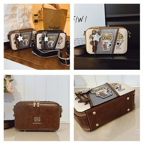 Detail shots of a brown and white contrast shoulder bag with cartoon cat and wide strap