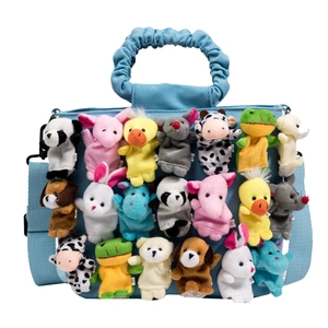 Blue canvas bag with cute plush animal finger puppets and ruffled handles for women
