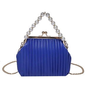 Royal blue pleated evening bag with pearl handle and gold chain strap in retro style