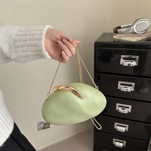 Light green cloud clutch bag with gold metallic handle and delicate chain strap