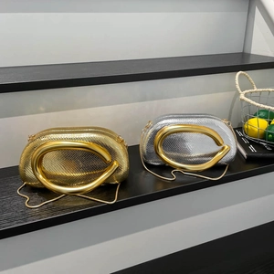 Chic metallic snake pattern mini wrist bags in gold and silver with C-shaped handles