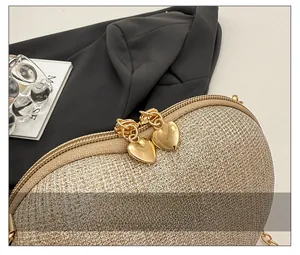 Detail of glitter evening bag with golden heart-shaped metal zippers and macro texture