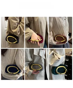 Detail view of fashion velvet evening clutch bags with gold C-shaped metal handles in 6 colors