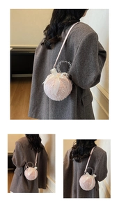 Close-up of pink fluffy plush bag with transparent beaded handle and white silk bow detail