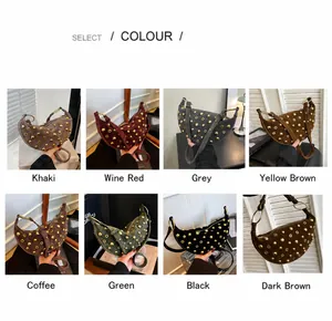 Detail view of crescent shoulder bags in eight matte suede colors with rivet studs