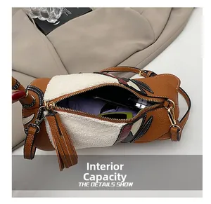 Detailed top view of cylinder crossbody bag showing large capacity for phone and umbrella