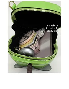 Macro shot of bright green patent leather bag interior showing daily essentials capacity