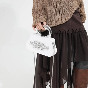 Elegant white hard shell evening clutch with floral rhinestones and silver handle