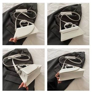 Detail views of white PU leather crossbody bag with irregular silver metal handle