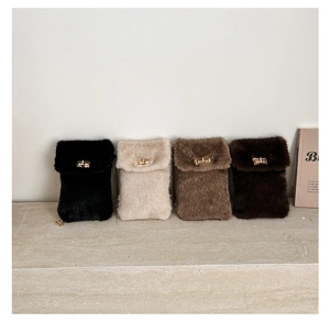 Detail view of plush crossbody phone bags in four neutral colors with gold twist locks