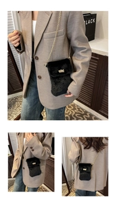 Detail of plush black faux fur phone bag featuring gold square swivel lock and chain strap