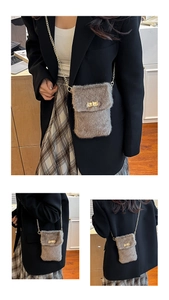 Detail of taupe faux fur crossbody bag with gold metal chain and vintage twist lock