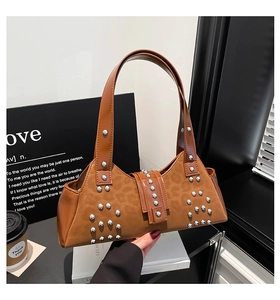 Detail shot of leopard print hobo bag with silver studs and a classic buckle closure