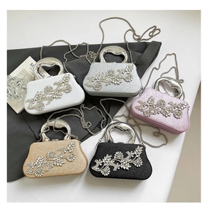 Five assorted glitter evening bags with rhinestone leaf accents and metal chain straps