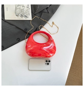 Mini red marble acrylic clutch bag with gold chain and mobile phone for size reference