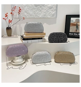 Detail of glitter evening clutch bags with sparkling rhinestones in five diverse colors