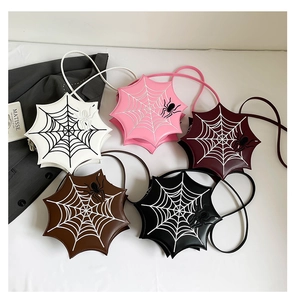 Five unique spider web crossbody bags in various colors for gothic fashion styling