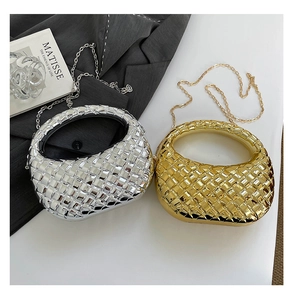 Close-up of woven metallic dumpling bags in gold and silver with chain straps