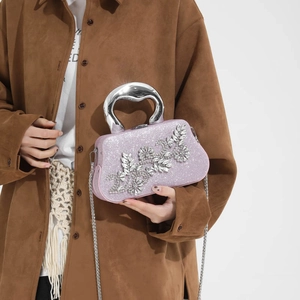 Sparkly pink sequin evening bag with rhinestone flower and silver metal handle