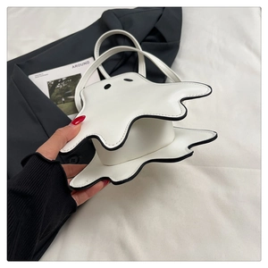 Detailed view of the white ghost shaped handbag made of premium matte PU leather