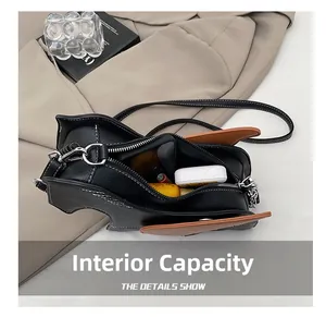 Interior view of black PU animal shaped crossbody bag showing daily essentials capacity
