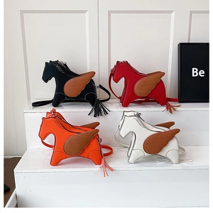 Detailed row of horse-shaped mini crossbody bags in black, red, orange, and white PU leather