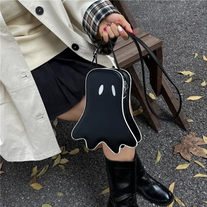 Ghost shaped black crossbody bag with white piping and eyes for Halloween fashion