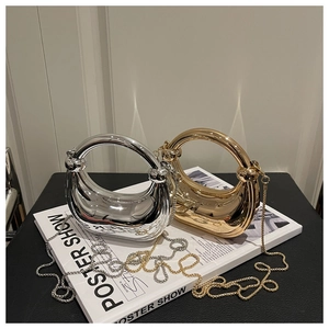 Chic gold and silver crescent bags with ring handles and chains on magazine