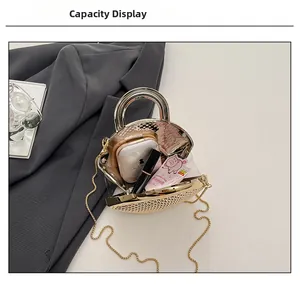 Macro view showing internal capacity of gold shell evening bag with daily essentials