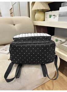 Detail showing the polka dot and stripe patterns on the backpack base and back view