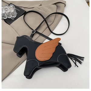 Detail of horse-shaped crossbody bag featuring lychee grain leather and contrast stitching