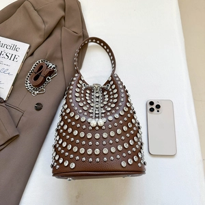 Brown leather bucket bag with silver rivets, pearl drawstring and metal chain strap