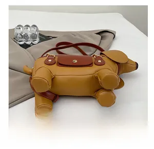 Macro view of dachshund puppy crossbody bag featuring durable base studs and PU leather finish