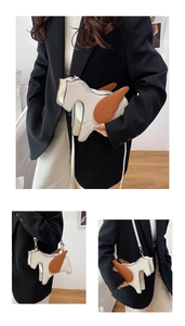 Detail of creative pegasus horse shaped crossbody bag with brown wing accents in PU leather