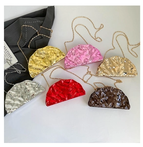 Detailed macro view of six metallic ice-crack textured acrylic shell evening clutch bags