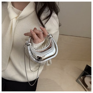 Silver mirror half-moon mini bag with liquid metal effect and sphere chain detail