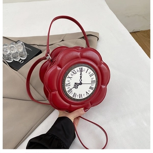 Detailed view of red flower-shaped handbag with vintage Roman numeral clock face
