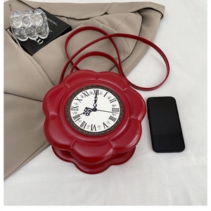 Detail of red flower-shaped crossbody bag with a vintage Roman numeral clock face